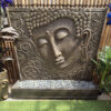 tall Buddha face water feature